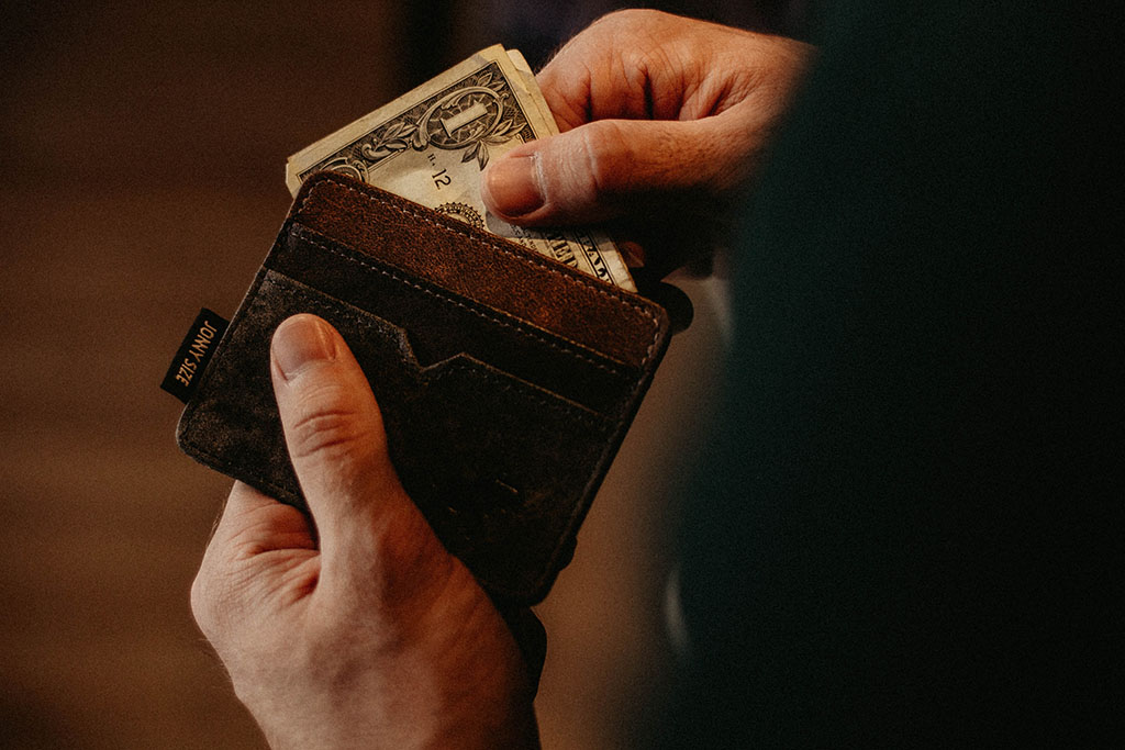 Savings research, dollar in wallet