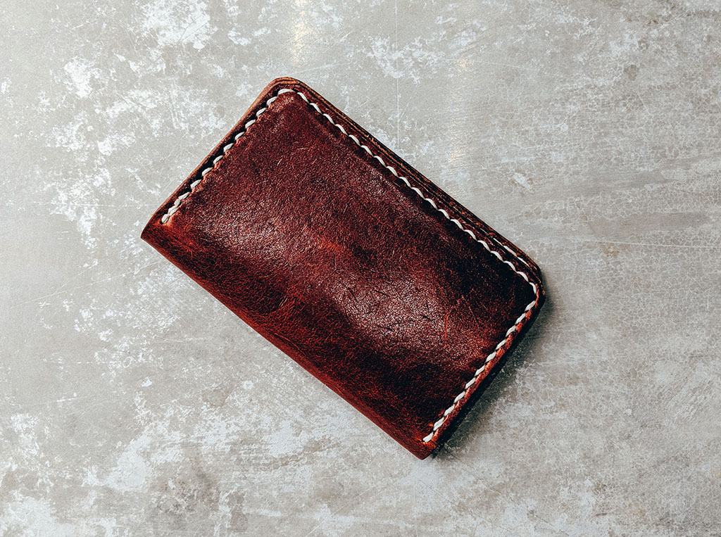 A worn leather wallet to illustrate health and financial wellbeing