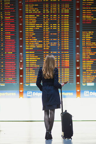 Travel industry thought leadership: a woman business traveler in an airport