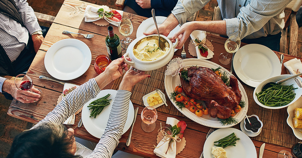 Family Giving Traditions for Thanksgiving, food shared over a dinner table, from Fidelity Charitable