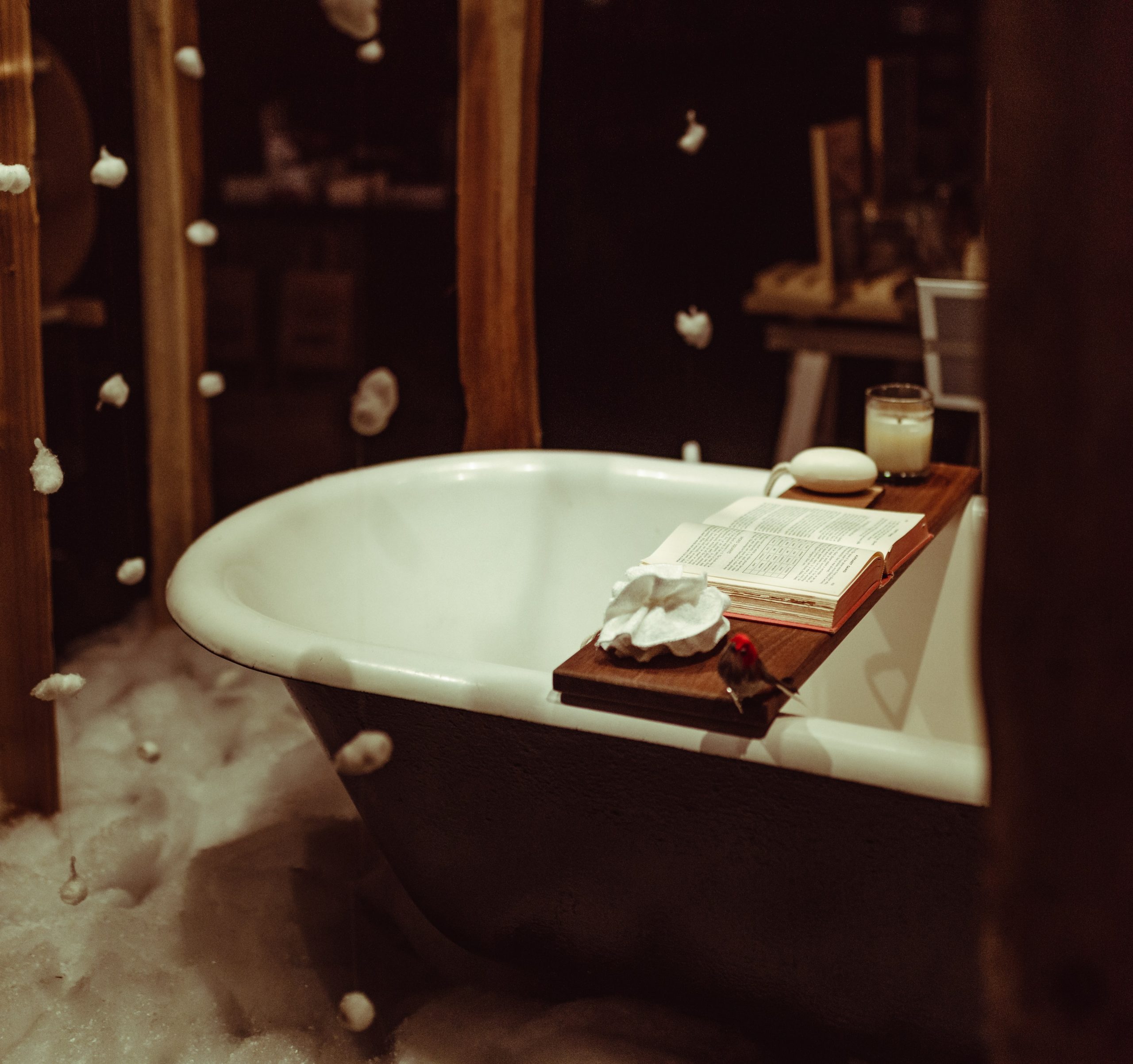 Cure for the COVID blues: A relaxing bath tub set up with a book