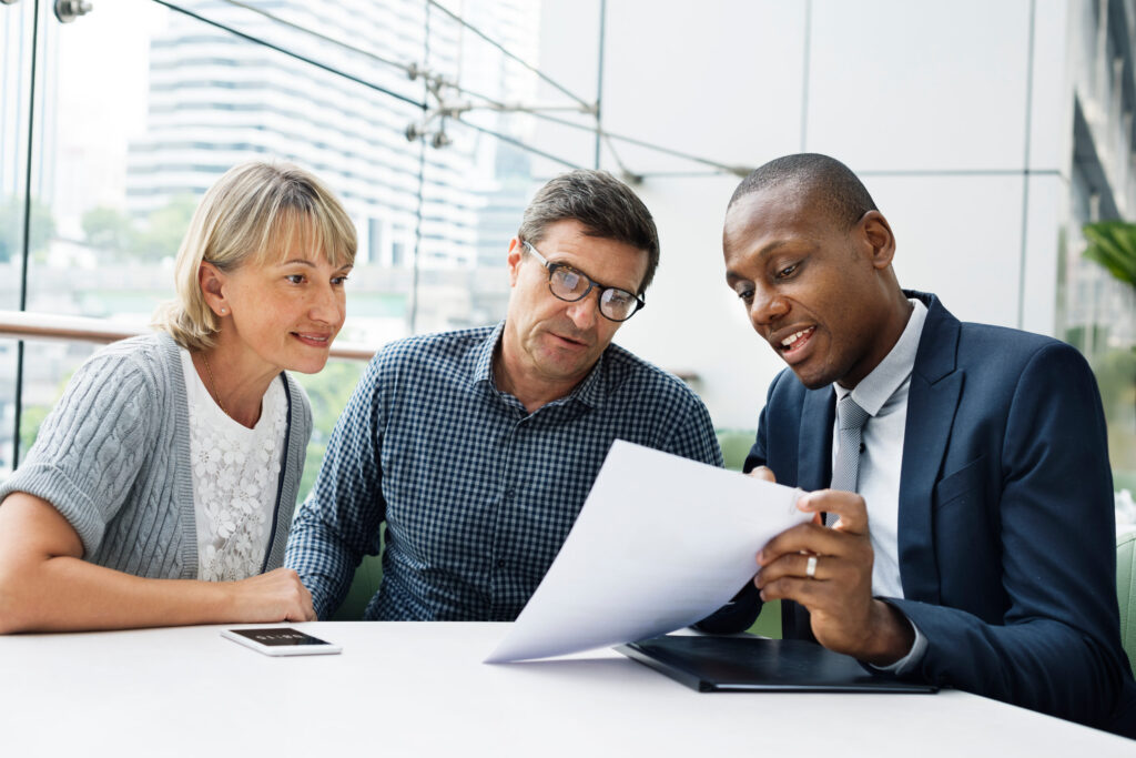 A financial advisor explaining something to clients