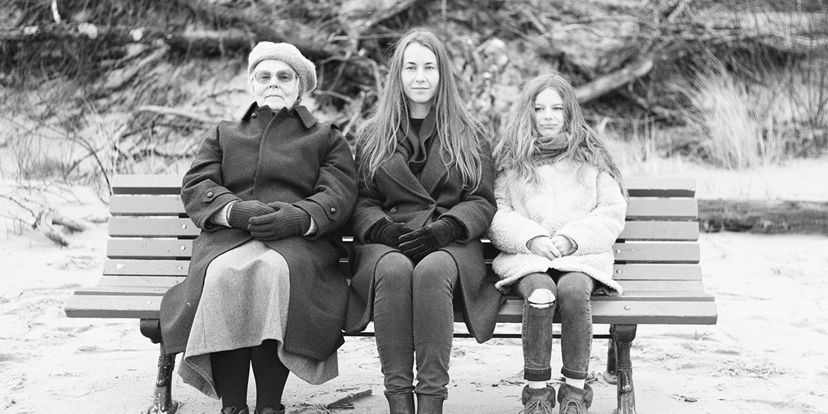 Women's progress across generations has stalled: multigenerational women on a bench