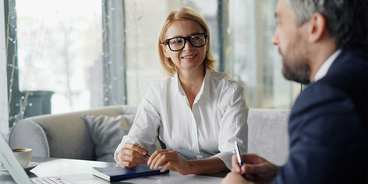 An investor discussing private markets with her financial advisor